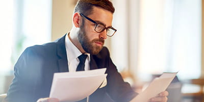 Businessman considering offers of mergers and acquisitions