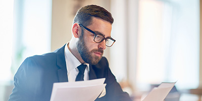 Man looking through papers
