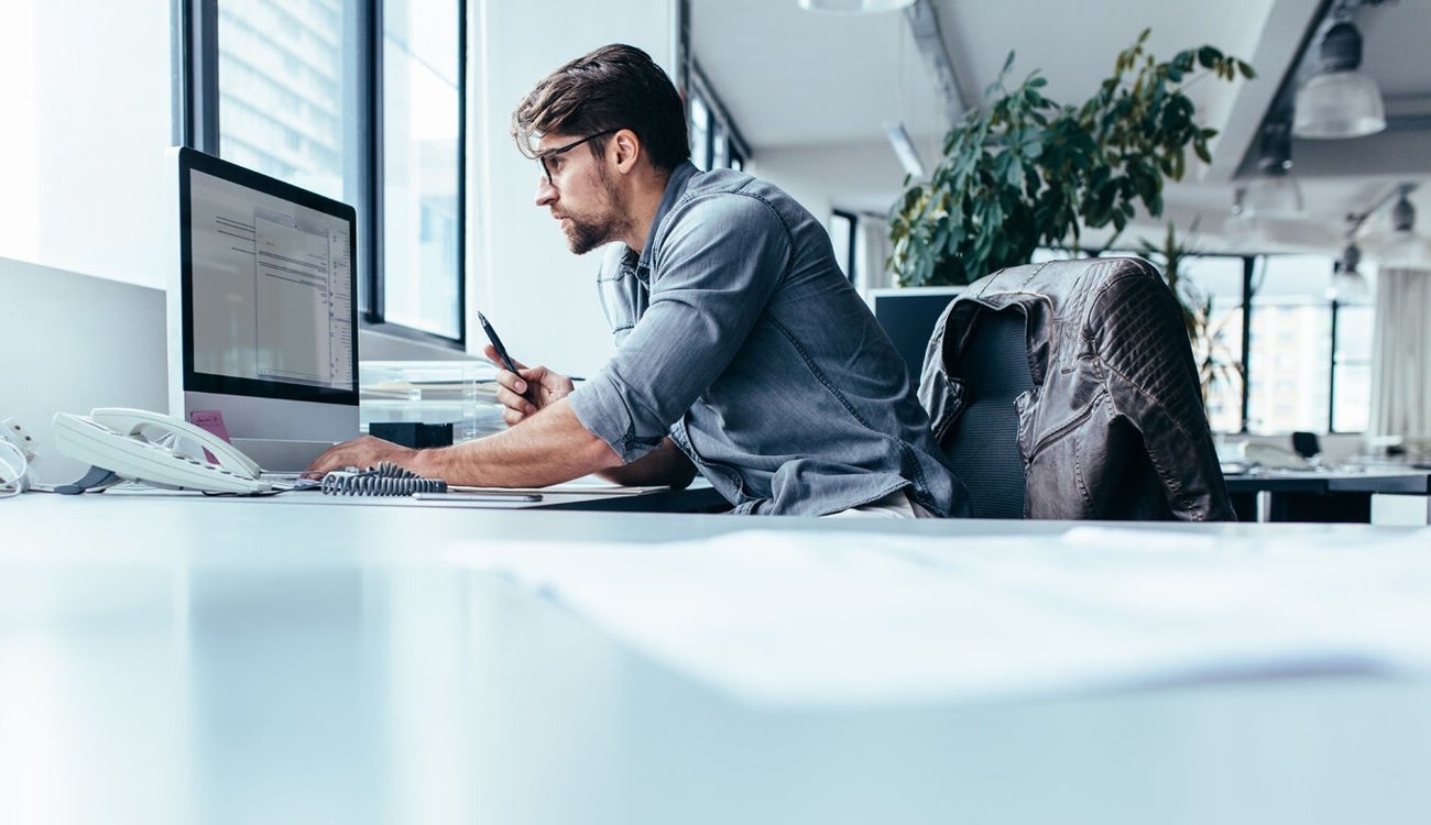 Man working on computer in office